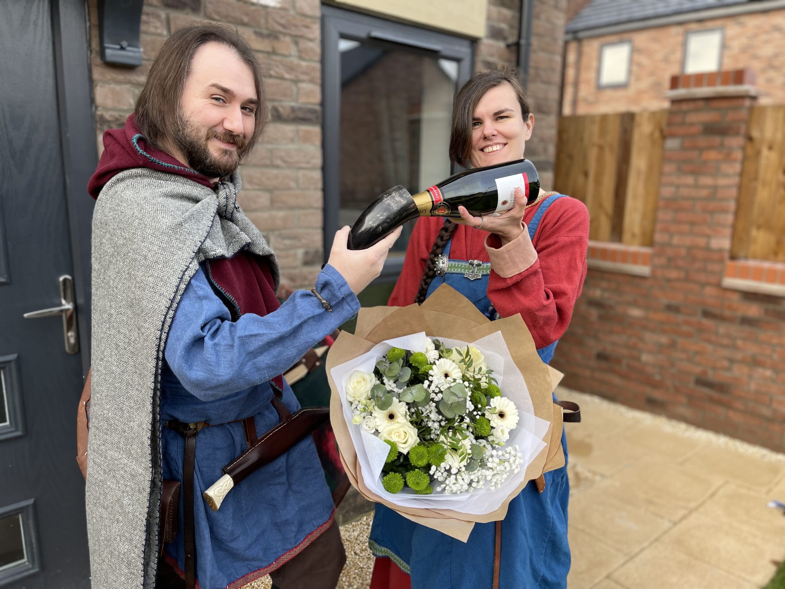 Josh (L) and Joanne (R) outside of their new home at Barley Folde-min